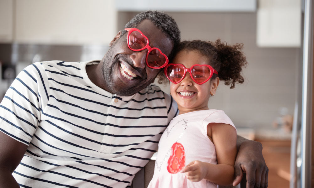 father holding daughter in hands