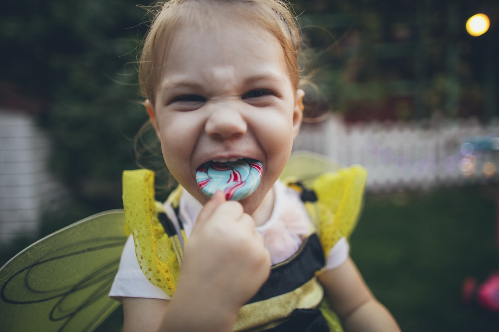 girl child eating lollipop