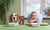 kid and dog sitting at dinner table waiting for food