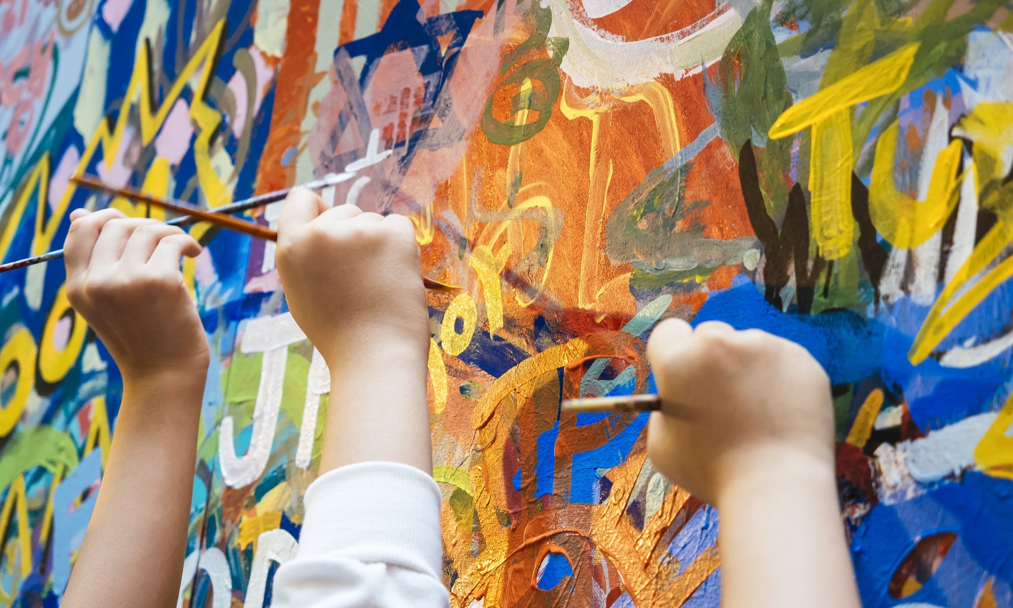 children painting on the wall