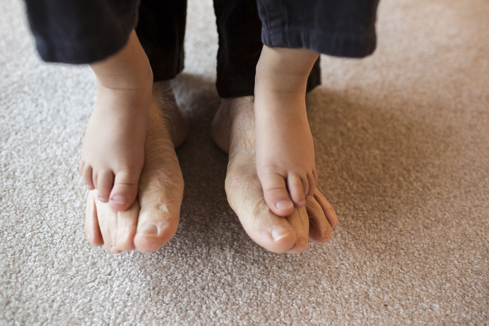 legs of grandmother and grand child