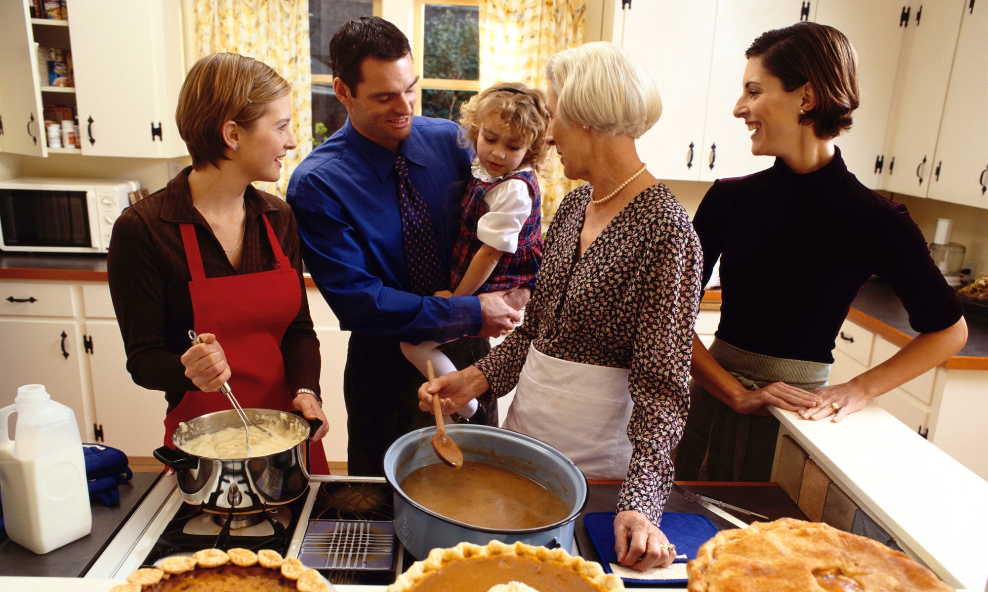 family having fun in the kitchen