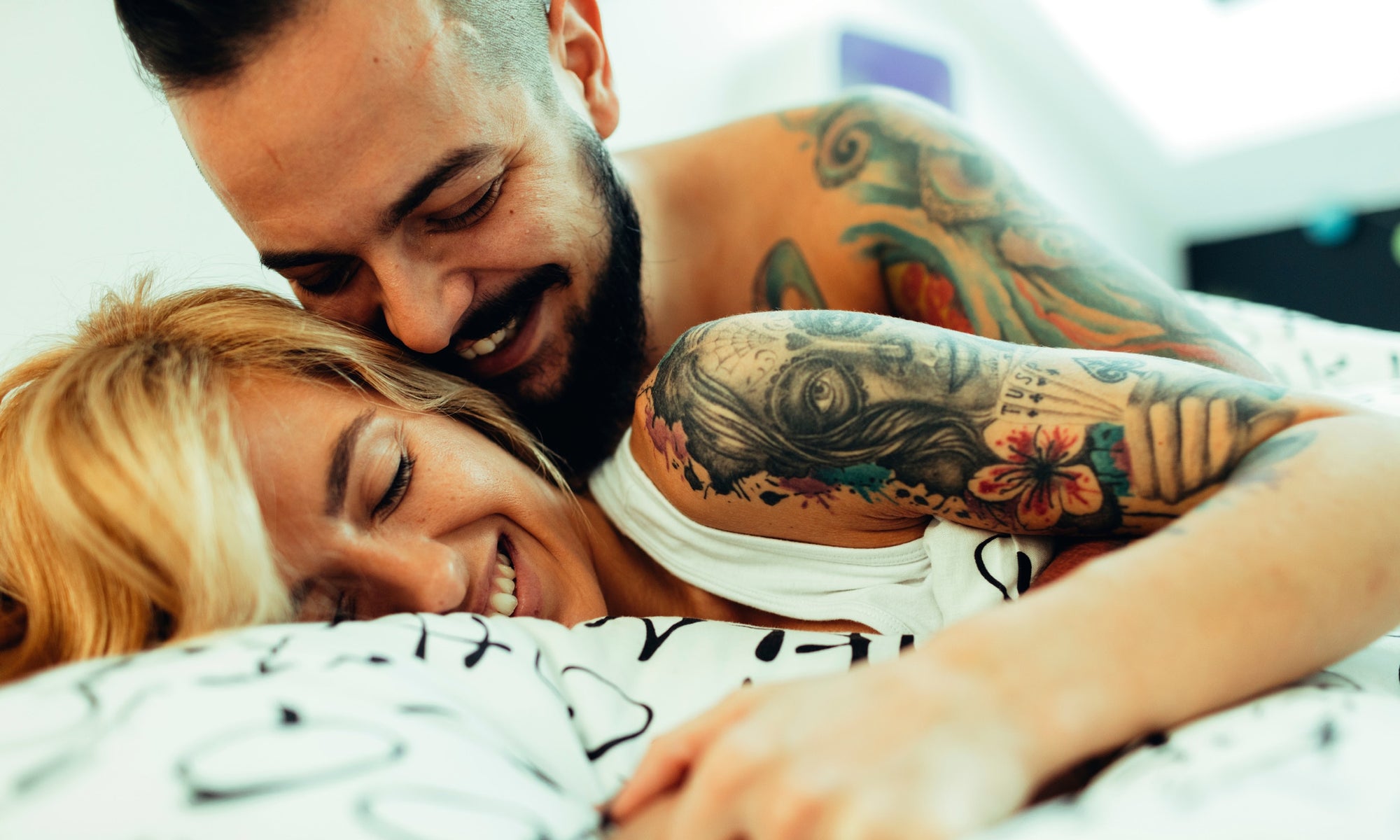 man and woman with tattoos