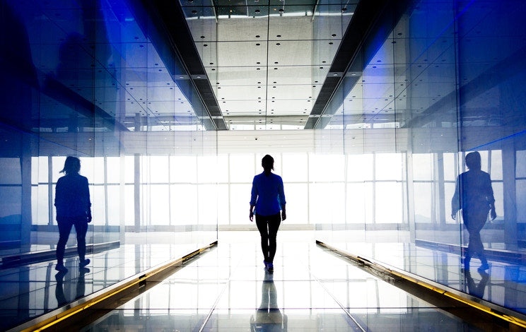 women walking in corridor