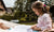 little girl studying outdoors on a sunny day