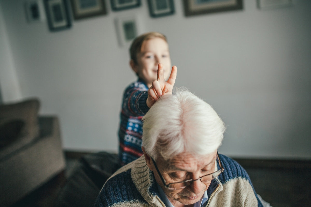 Boy playing with grandfather