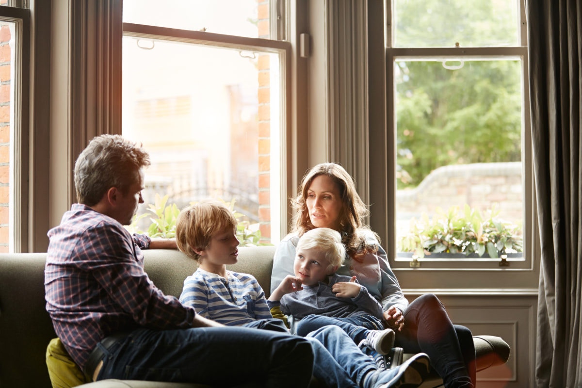 Family sitting on a sofa