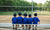 little boys sitting on bench in school ground