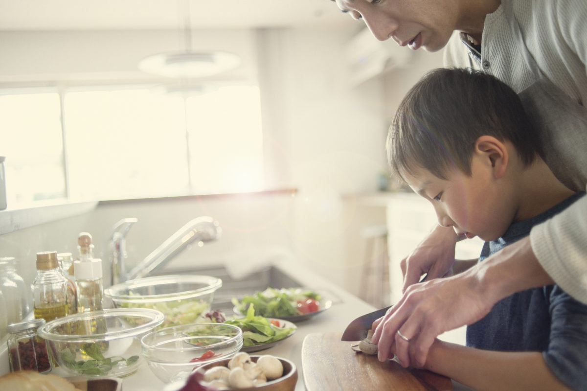 Father And Son Cutting The Mushroom With a knife