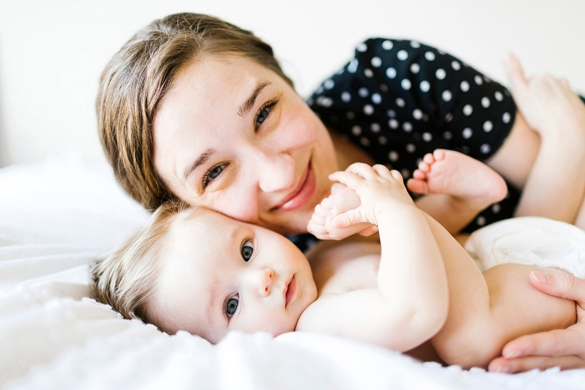 young mother and son looking at camera