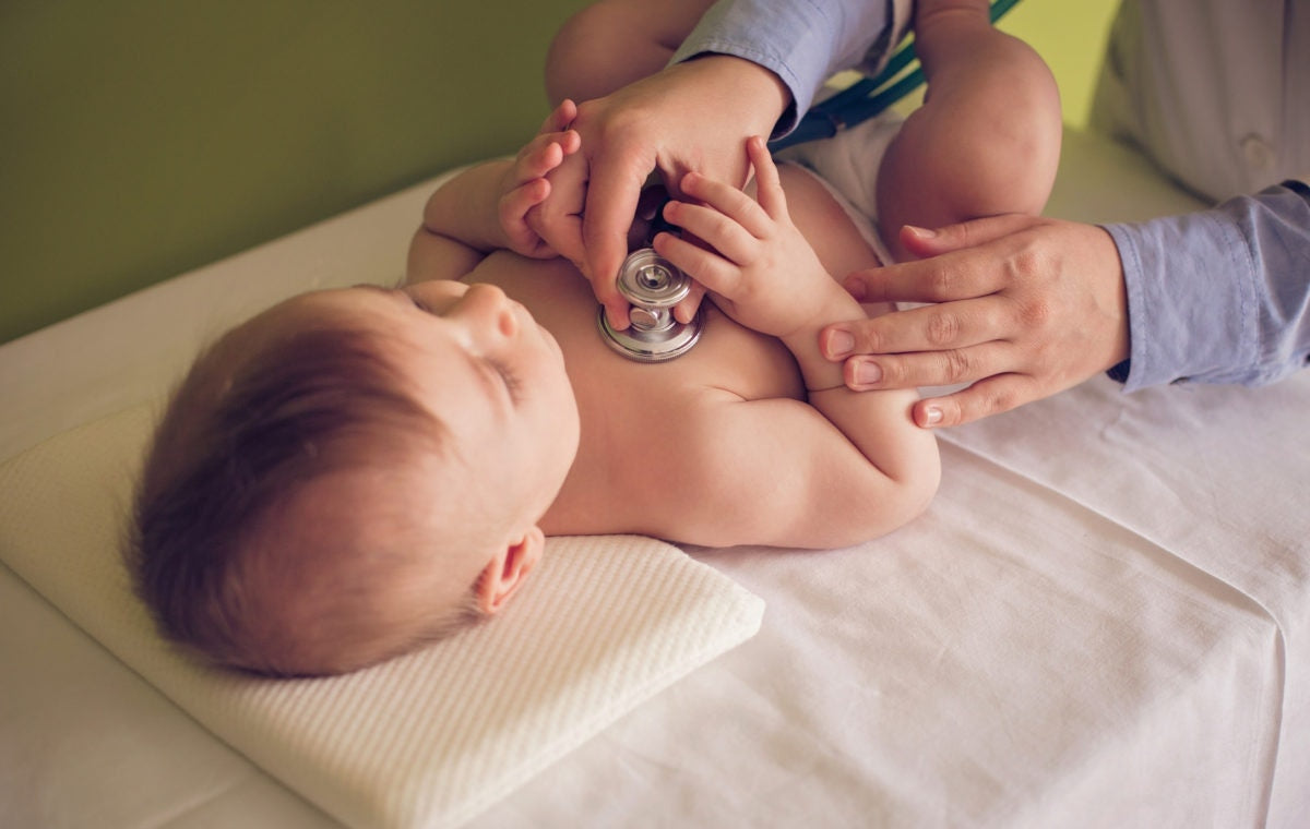 doctor checking the heartbeat of a baby