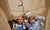 boy and girl lying together in bed looking up