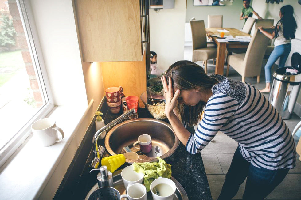 exhausted mother in kitchen