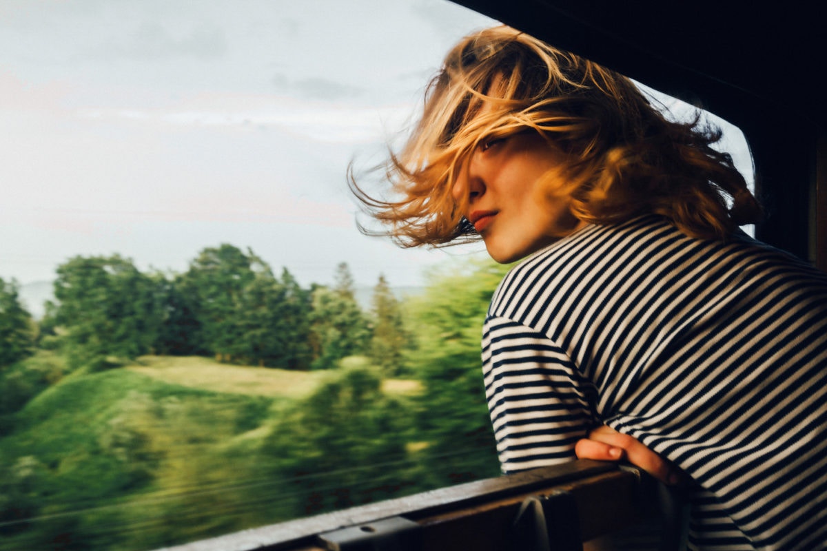 woman emjoying her ride with her hair  flying in air