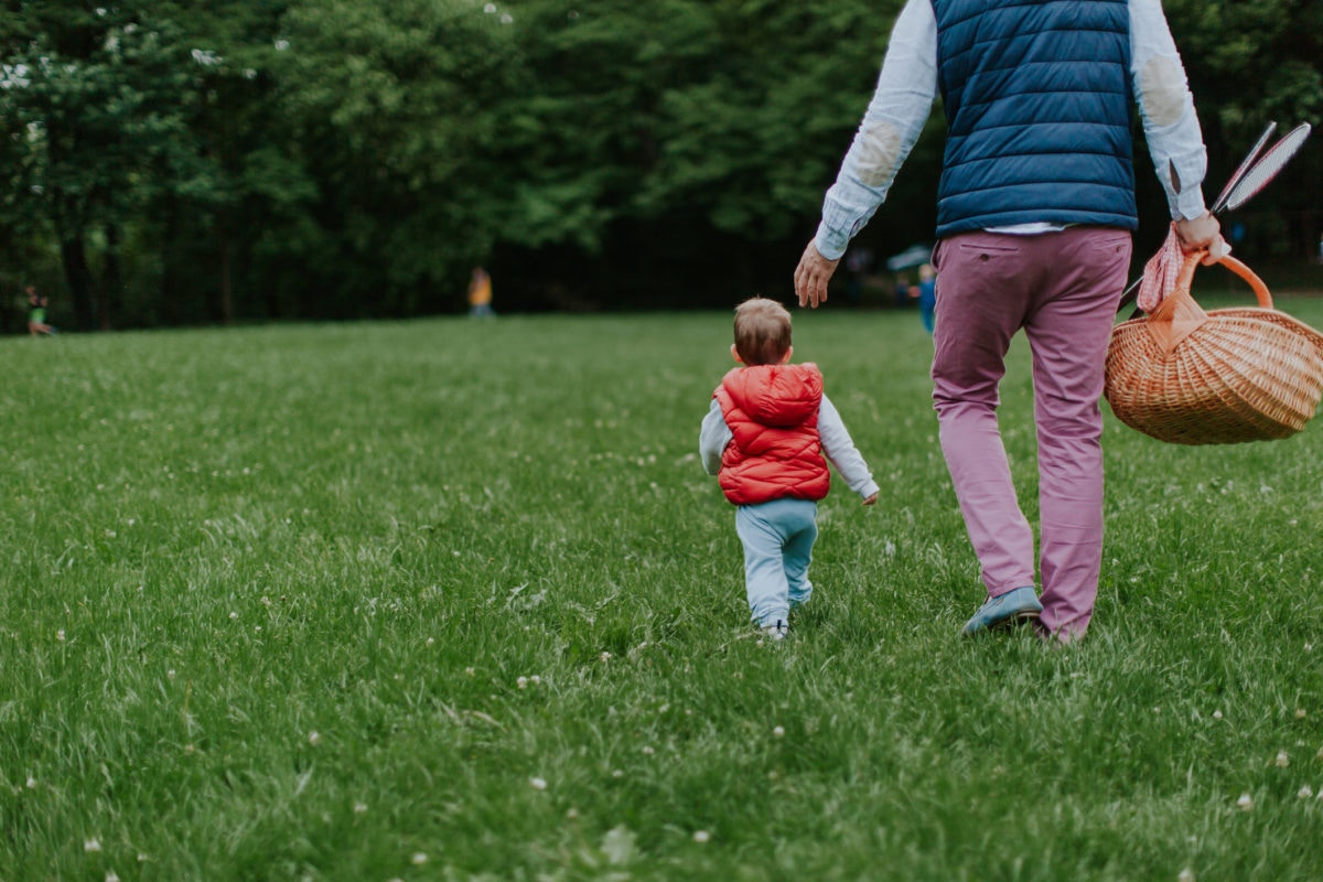 A child going with father on a picnic