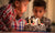 Young boy blowing out candles on birthday cake