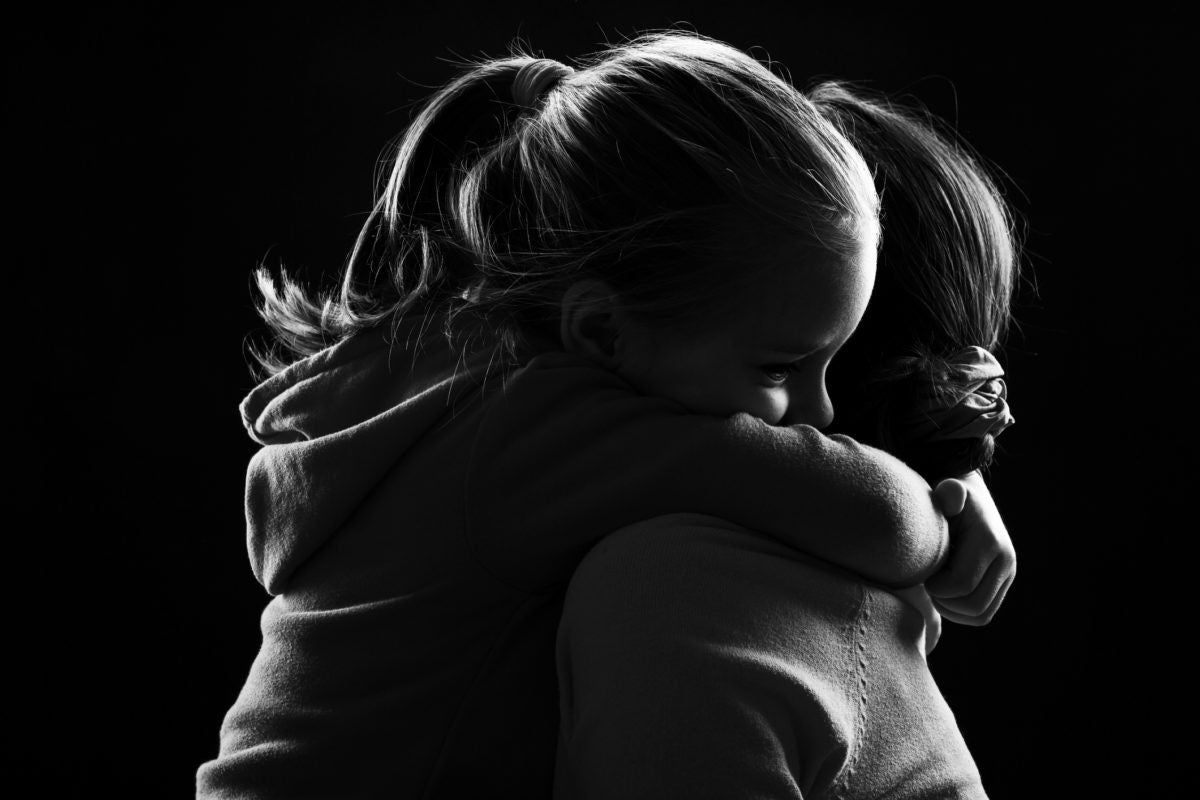 A girl holding her mother