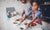 Children making something with flour on the kitchen