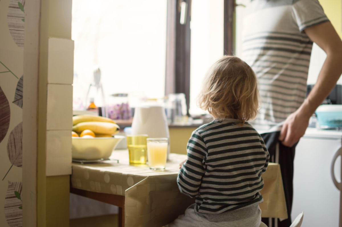 father and child at dinner table