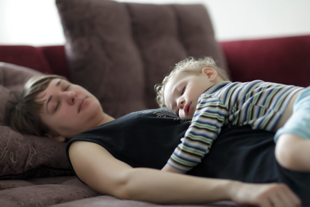 baby boy lying on mother's stomach