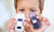 boy holding two toy cars