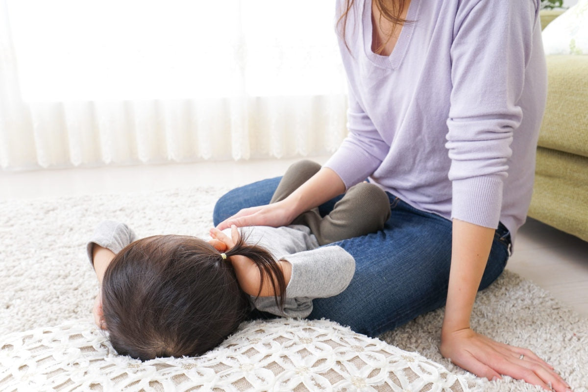 Baby sleeping on floor