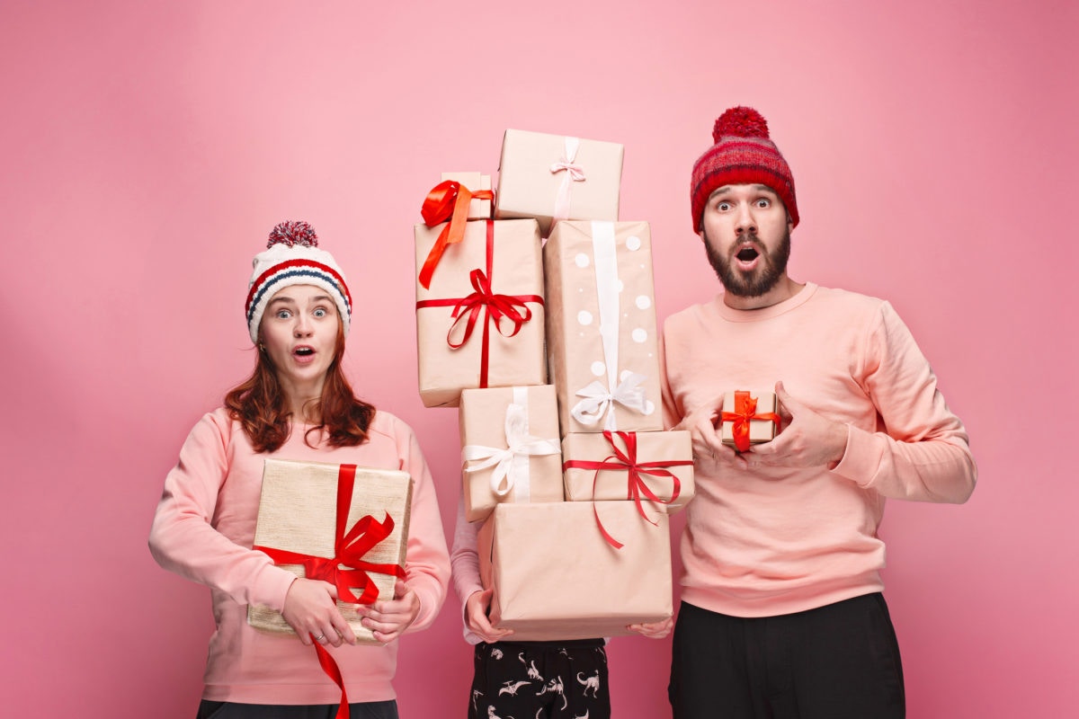 Family members holding full of gifts