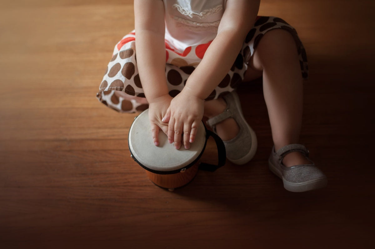 A kid playing instrument