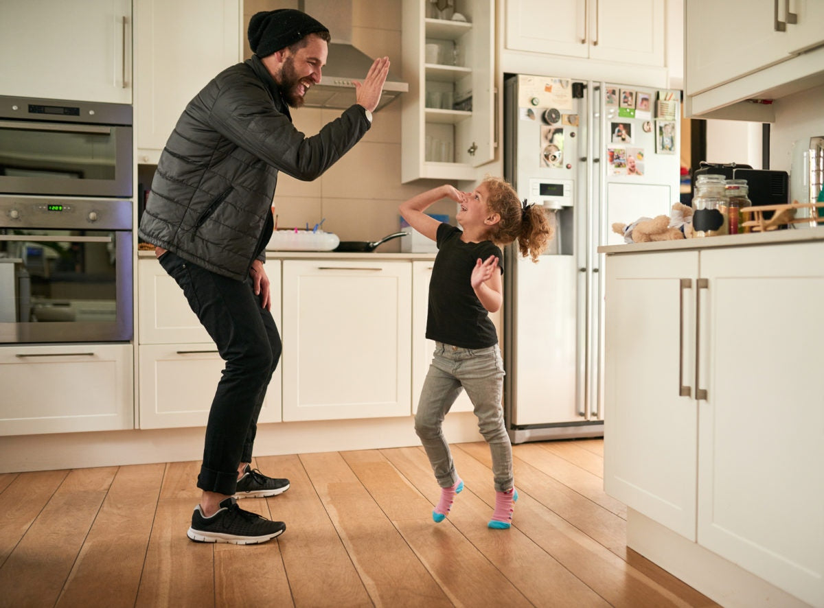 A father and kid is giving hand together with full of happiness