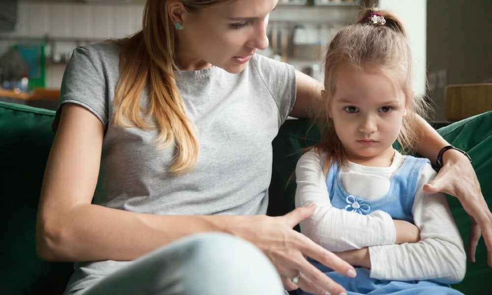 angry offended little girl ignoring mother words