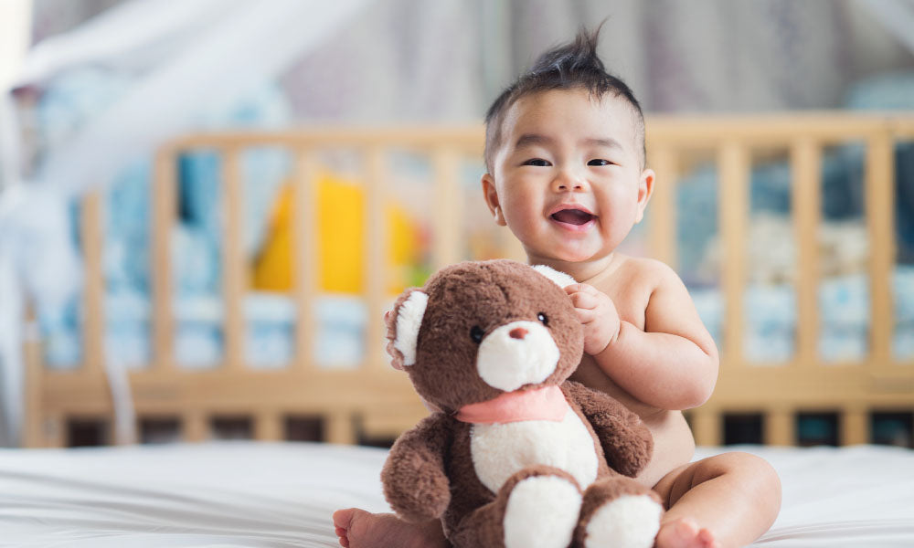 baby with teddy bear