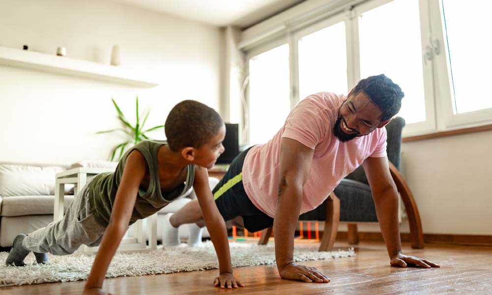 father and son excerising at home