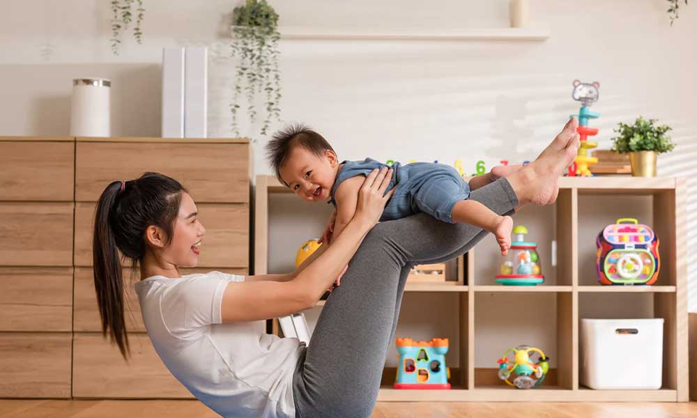 mother playing with baby