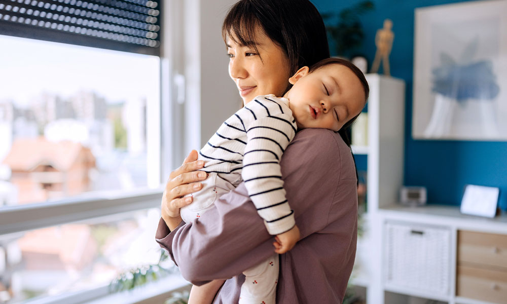 mother holding baby