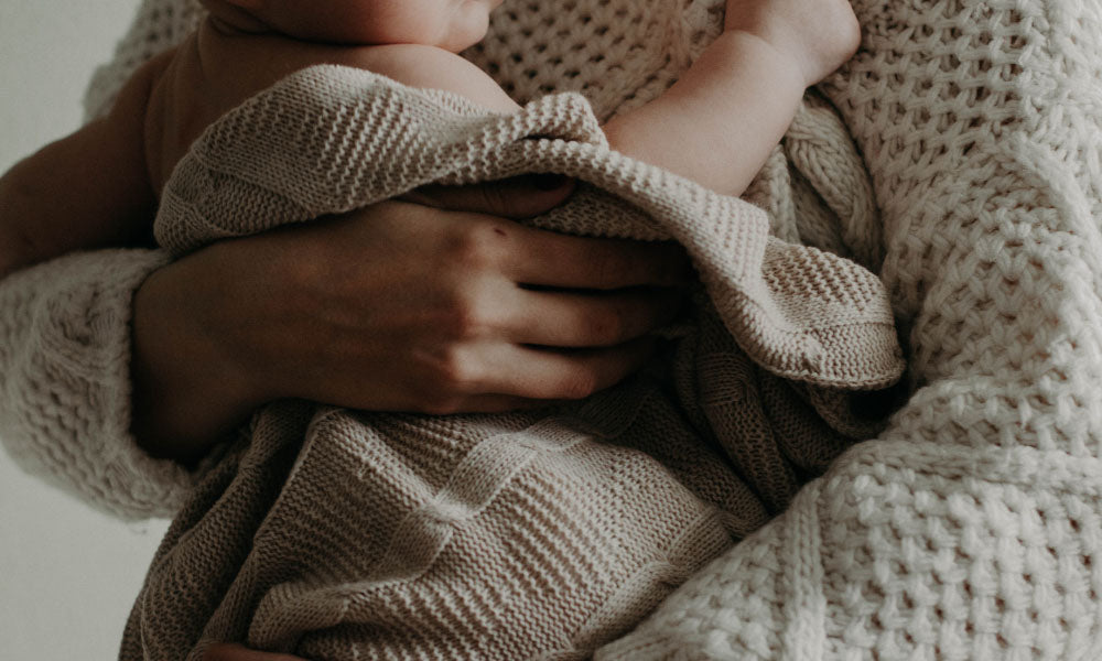 woman holding baby 