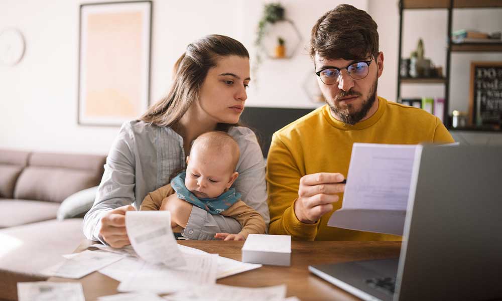 young family managing budget and paying bills